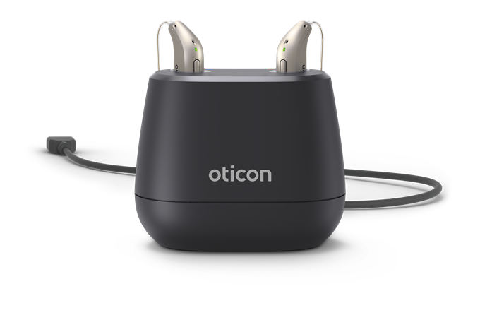 Chargeur Oticon avec deux aides auditives rechargeables